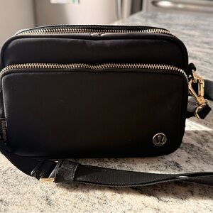 lululemon black crossbody with gold zippers